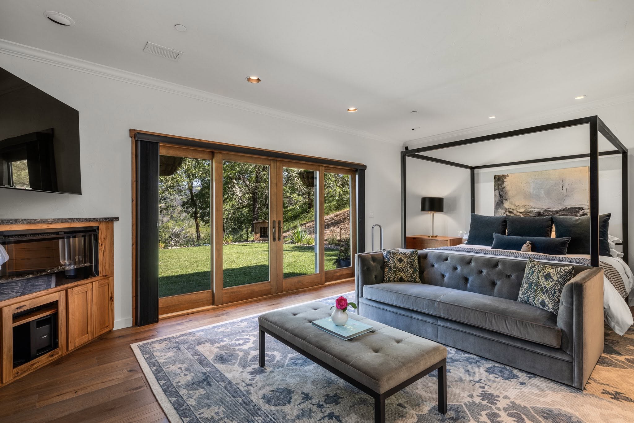 Bedroom suite with seating area facing the yard