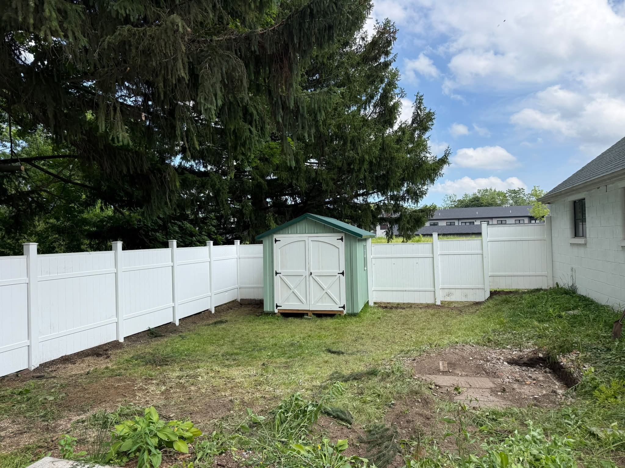 New vinyl fence and garden shed installation